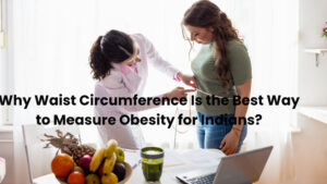 Nutritionist checking waist size of an Indian woman to evaluate belly fat risk.